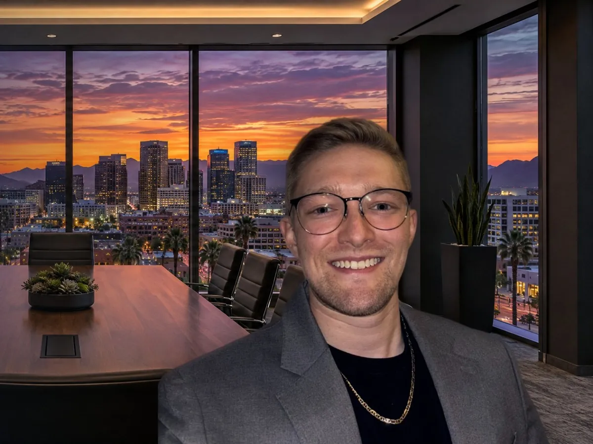 Cole Mello, founder of Altura Marketing Group, with the Phoenix skyline at sunset